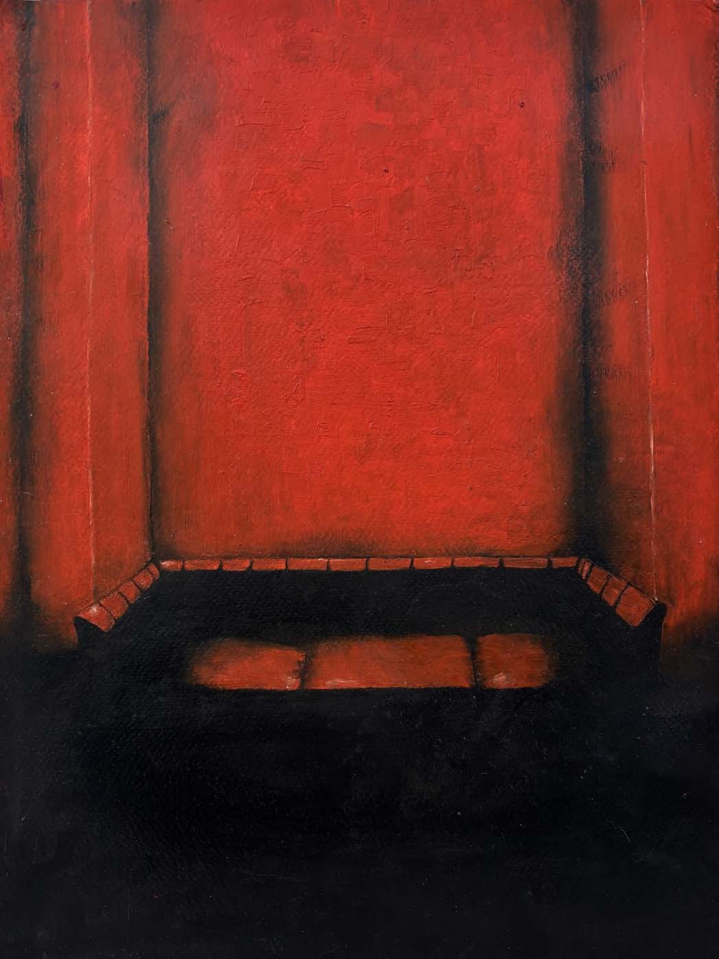 An empty sofa in a dark red room.